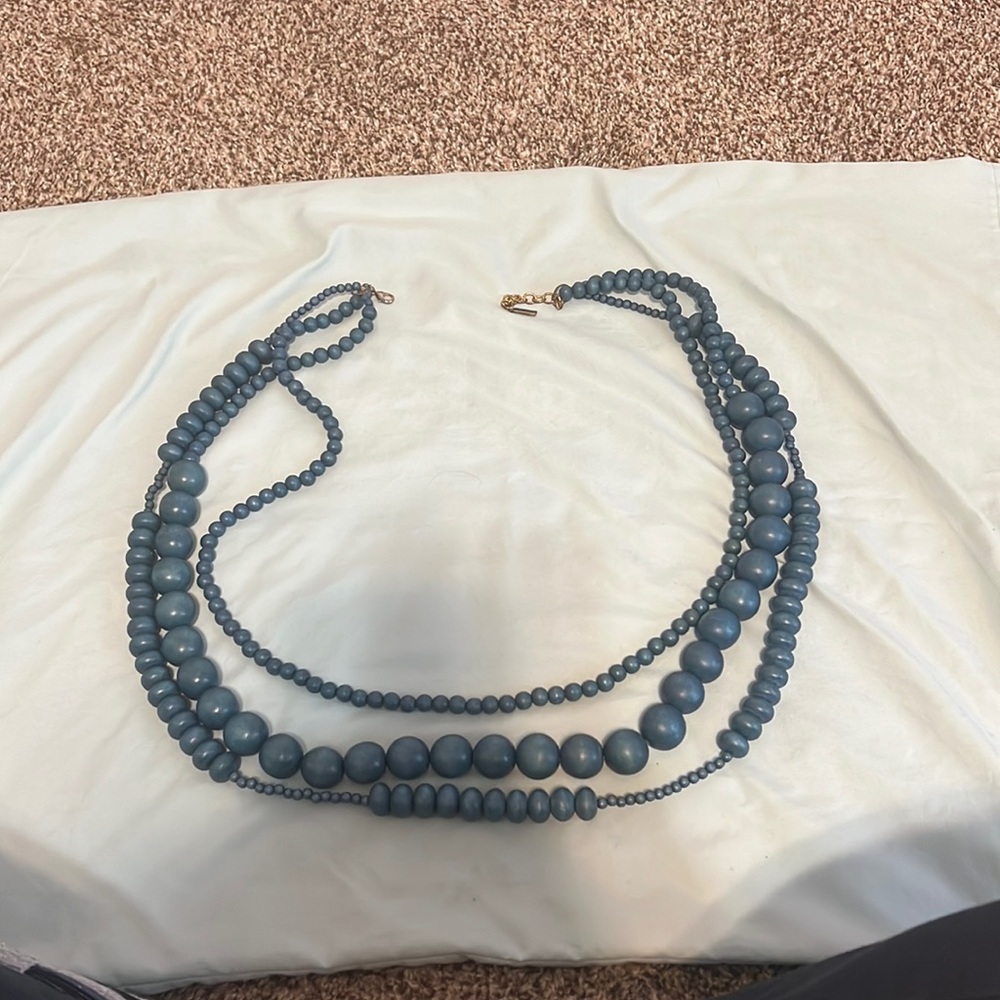 Triple strand beaded necklace.